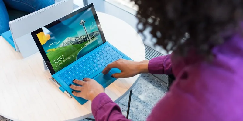 Colleagues on a Microsoft Teams video call in a meeting room