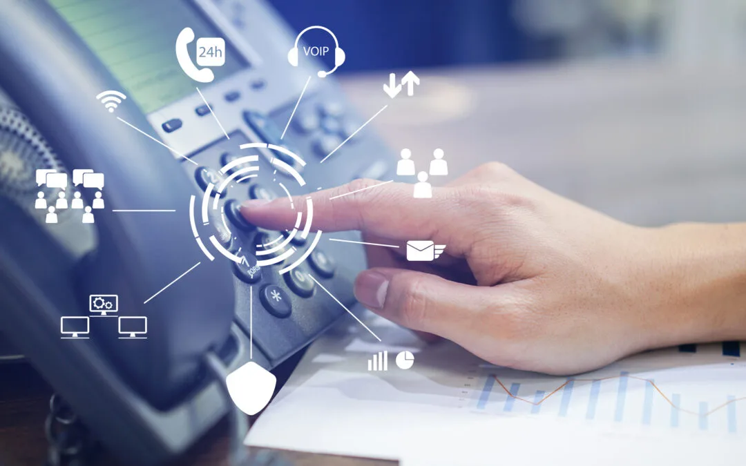 GR IT Services engineer configuring an IP telephone system at a Dubai office